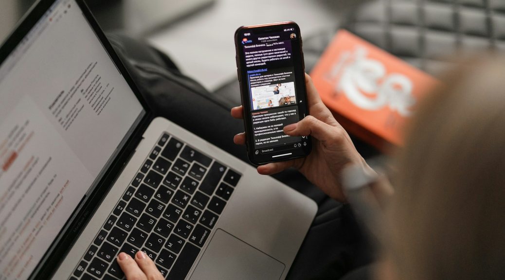 person holding black iphone 4